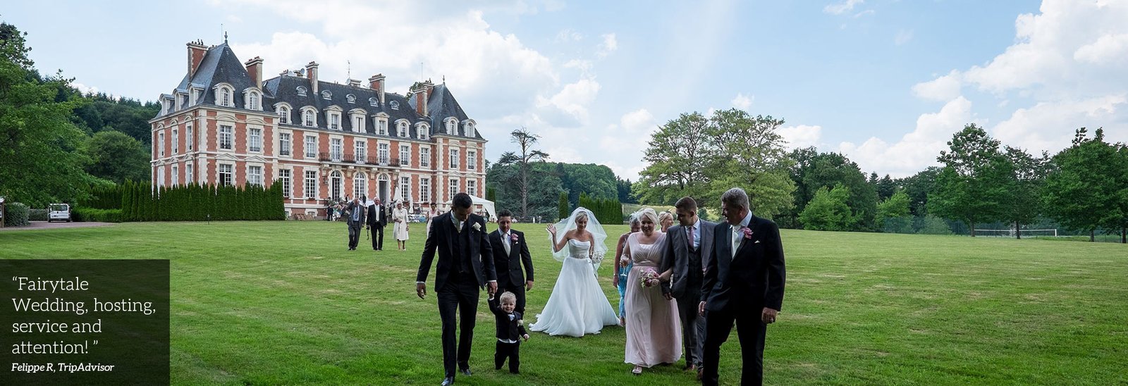 Wedding party walking accross grounds